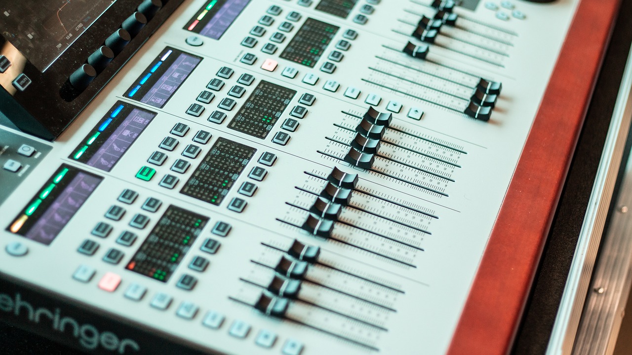 a sound board sitting on top of a wooden table, user interface, white panels, avatar image, theatre equipment