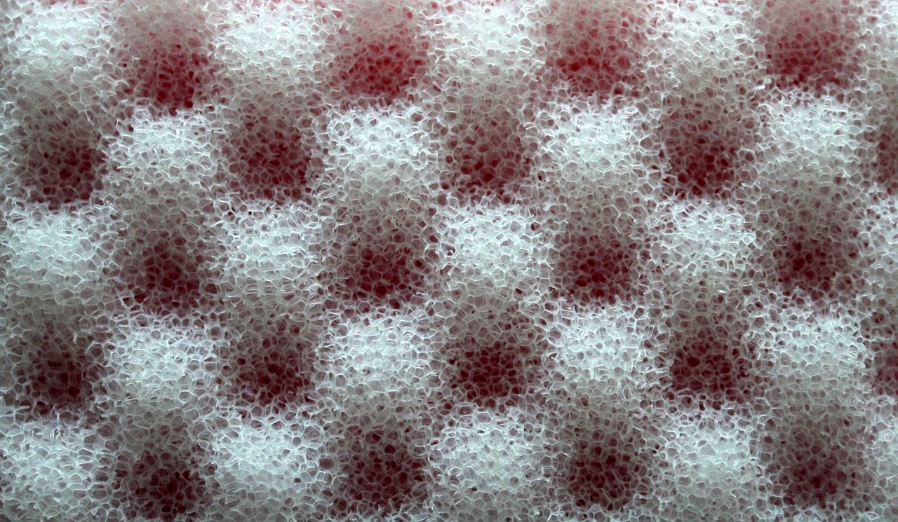 a close up of a red and white checkered cloth, a stipple, by Jon Coffelt, foamy bubbles, transparent carapace, virus, tesselation