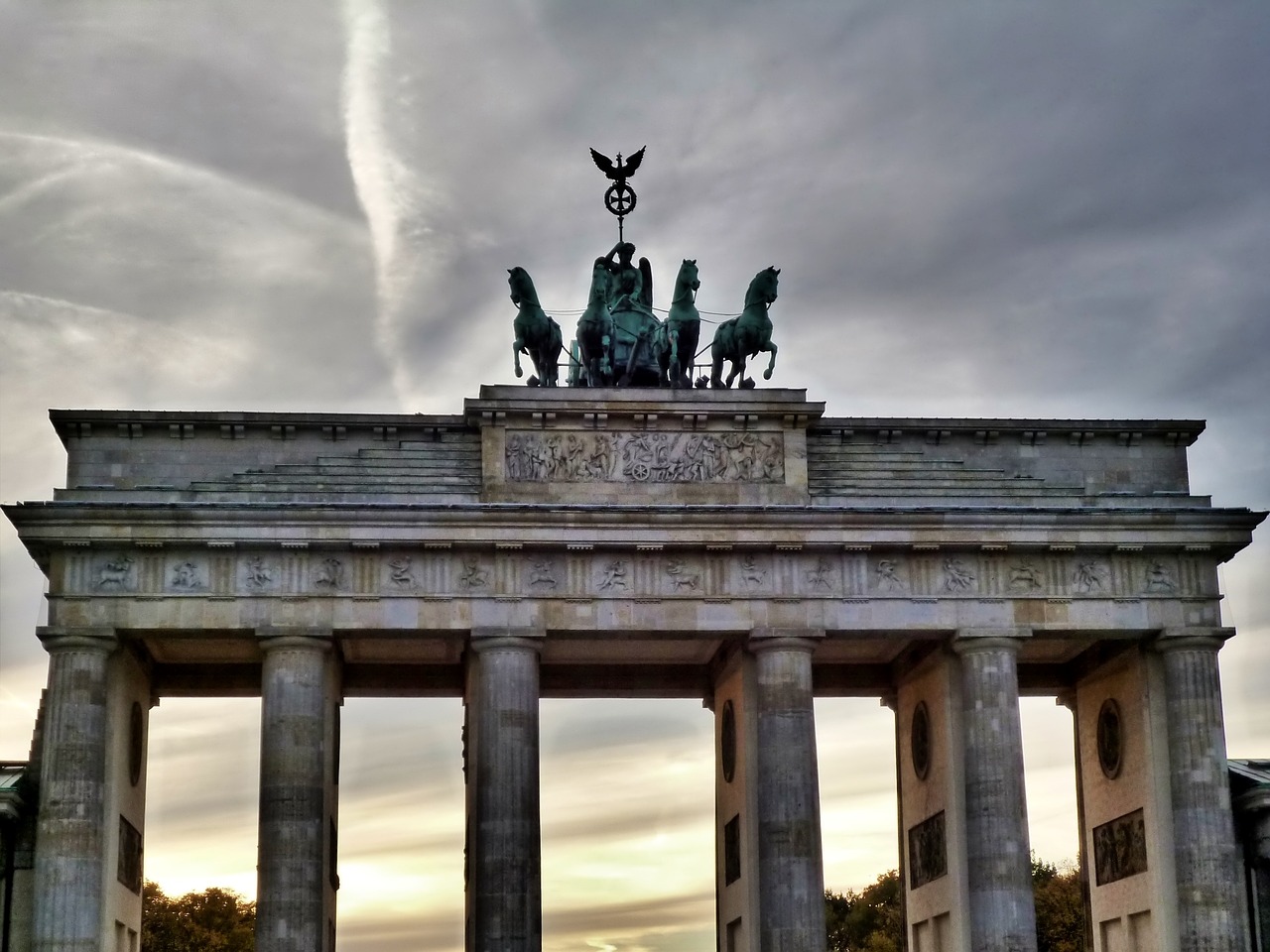 a group of people that are standing in front of a building, a statue, pexels contest winner, berlin secession, an archway, untethered stelae, bridge, high quality image