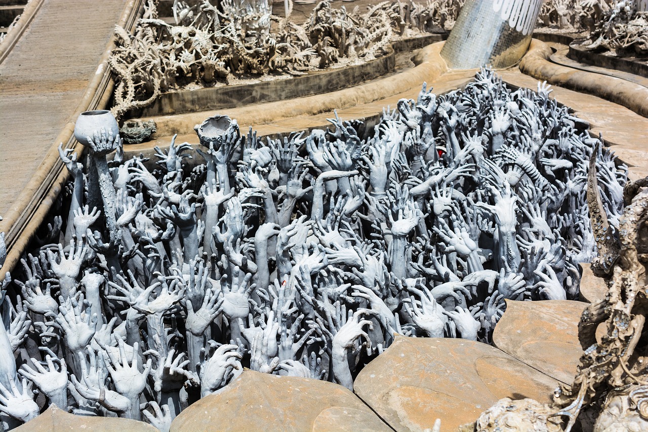a bunch of hands sticking out of a pool of water, an abstract sculpture, by Ai Weiwei, shutterstock, sedlec ossuary, white metal, many suckered tentacles. hybrid, the gates of hell