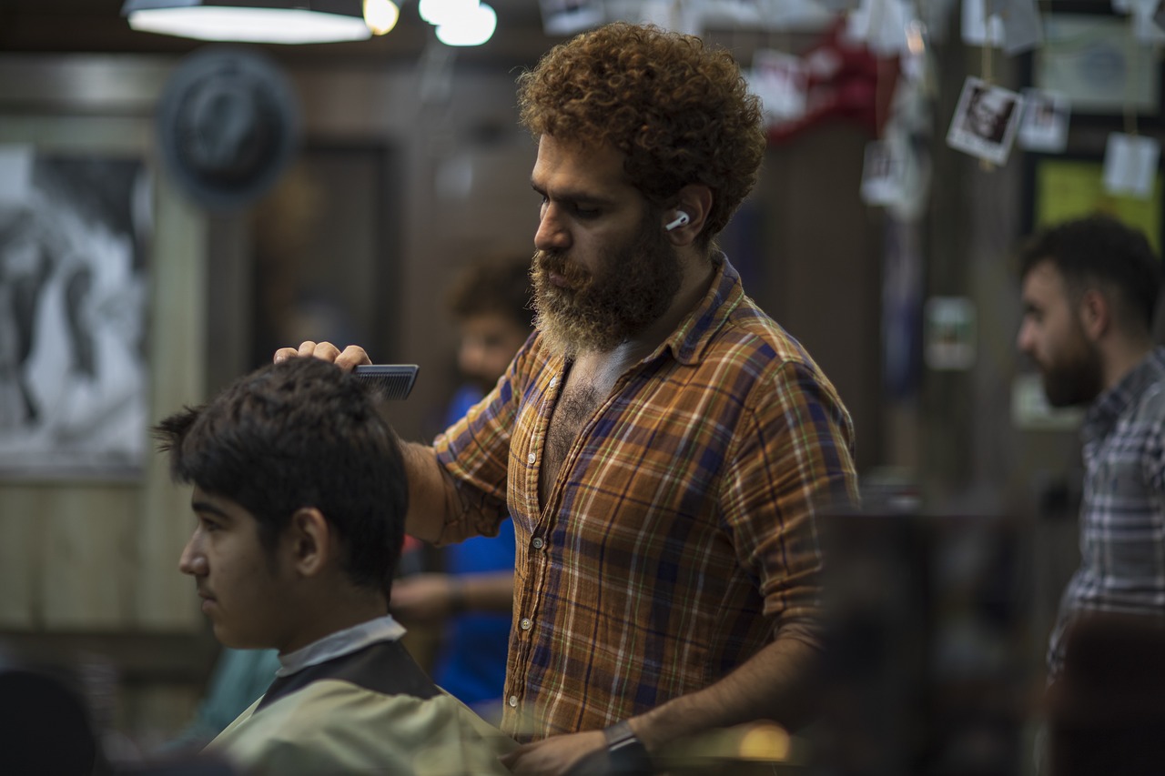 a man getting his hair cut at a barber shop, by João Artur da Silva, still from a live action movie, curly haired, dustin lefevre, india