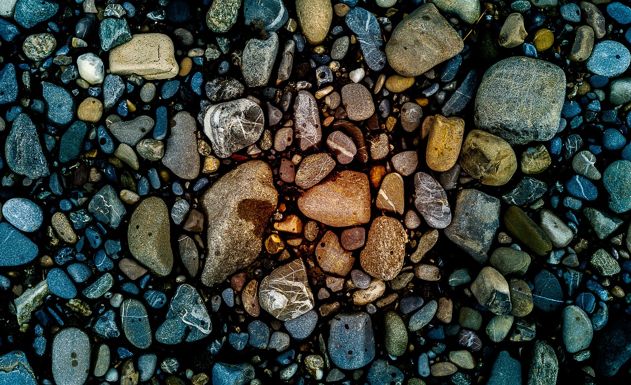 a heart made out of rocks on a beach, a microscopic photo, by Jan Rustem, unsplash, amoled wallpaper, intricate cobblestone, color ( sony a 7 r iv, ((rocks))