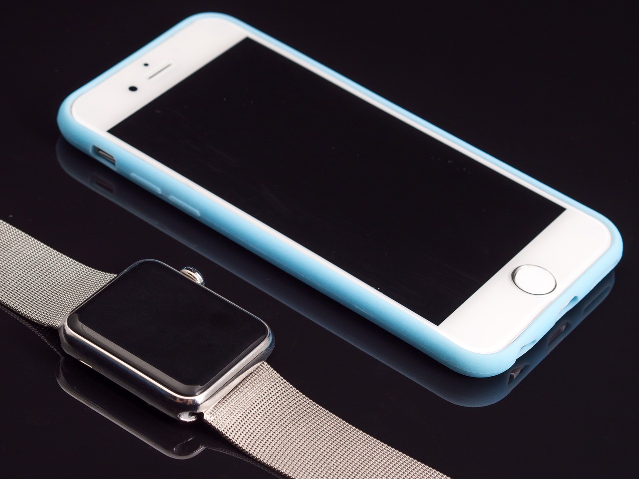 a smart phone sitting next to an apple watch, pixabay, light blues, shot on iphone 6, true realistic image, stainless steal