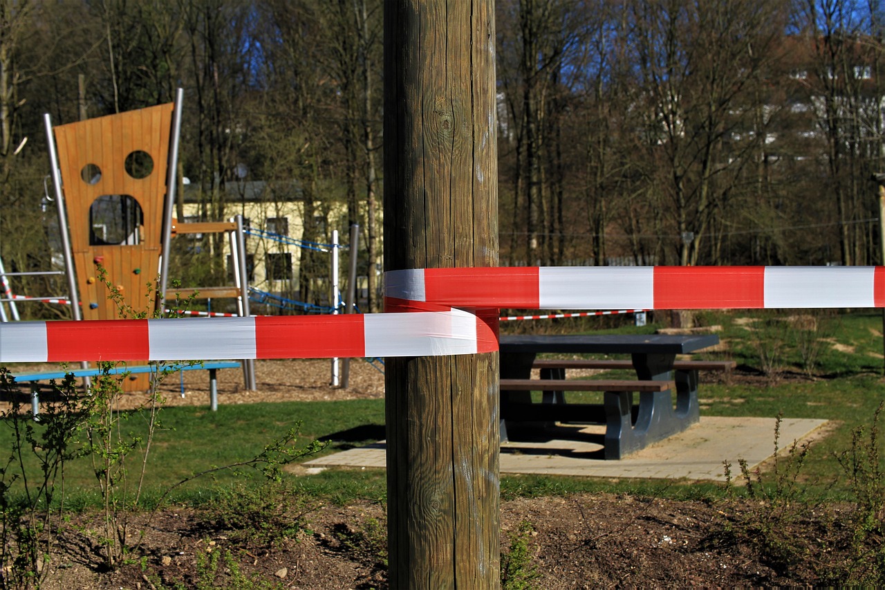 a red and white barricade in a park, by Werner Gutzeit, pixabay, realism, police tape, adventure playground, balance beams, square