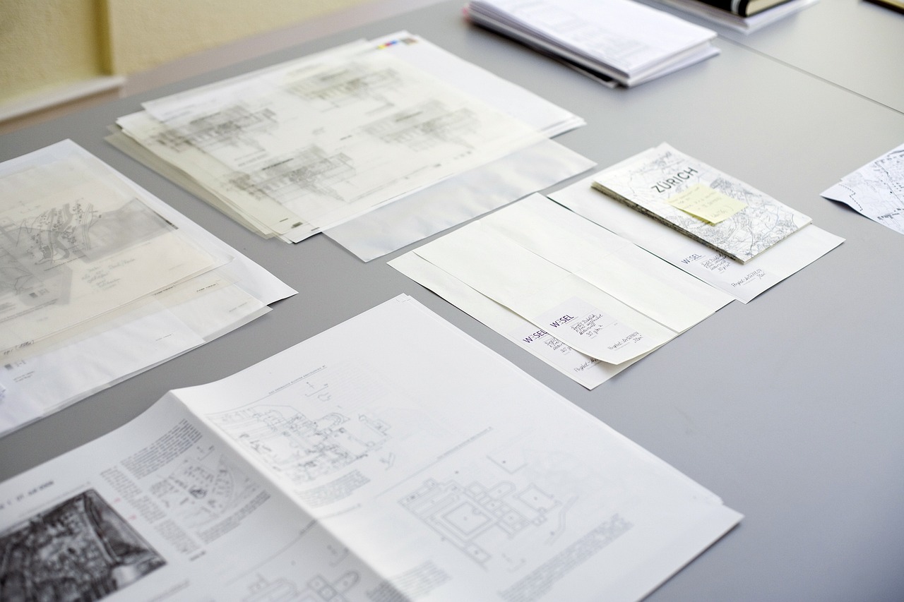 a bunch of papers sitting on top of a table, a picture, behance, technical drawings, court archive images, complex design, listing image
