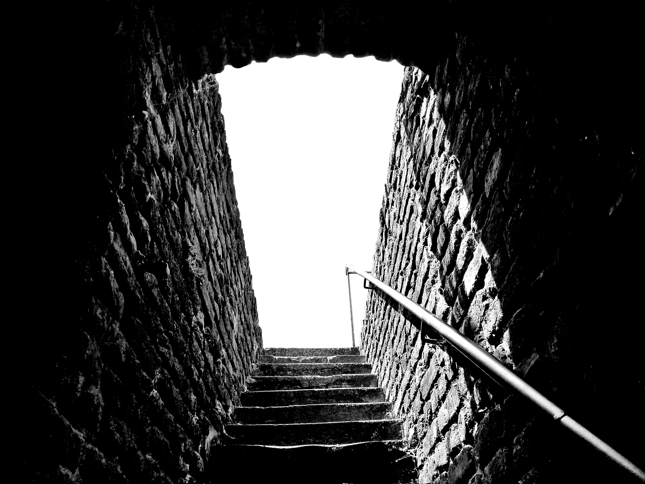 a black and white photo of a set of stairs, by Konrad Krzyżanowski, pexels, inside a dungeon, enter night, sunken, pc wallpaper