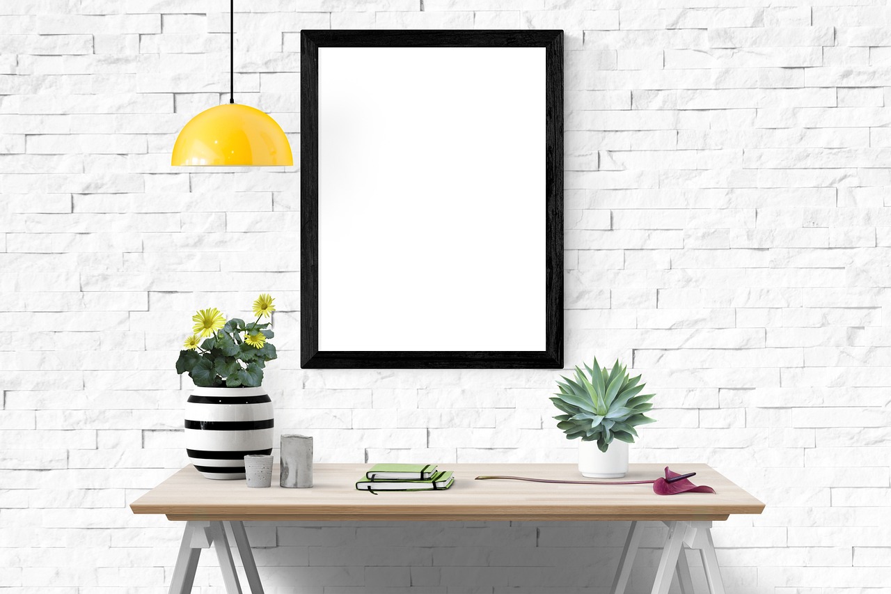 a picture frame hanging on a white brick wall, a poster, pixabay, papers on table, black border, home office interior, istock