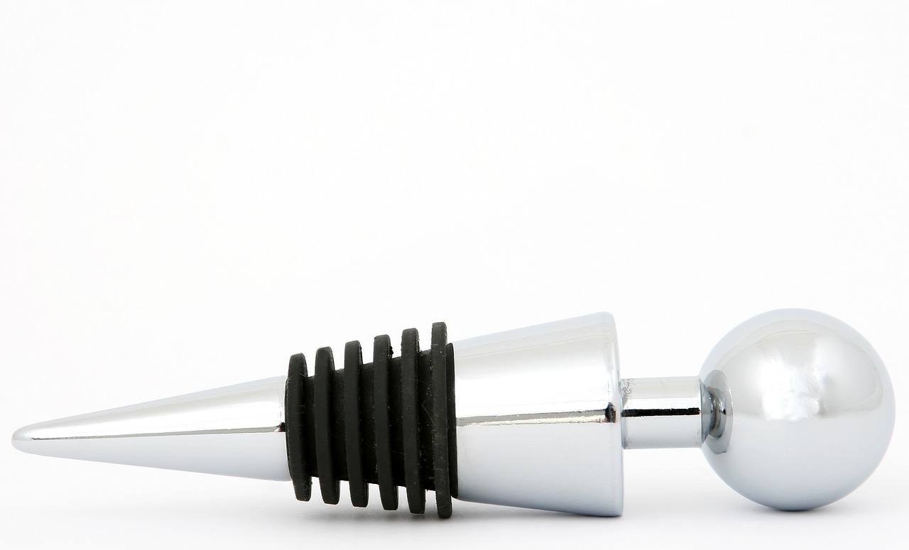 a close up of a bottle stopper on a white surface, a stock photo, inspired by Jan Karpíšek, classic chrome, jean paul gaultier, cone, professional product photo