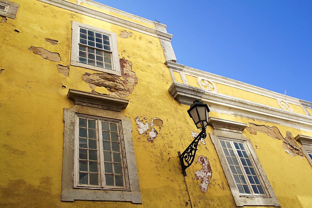 an old building with some windows and shutters