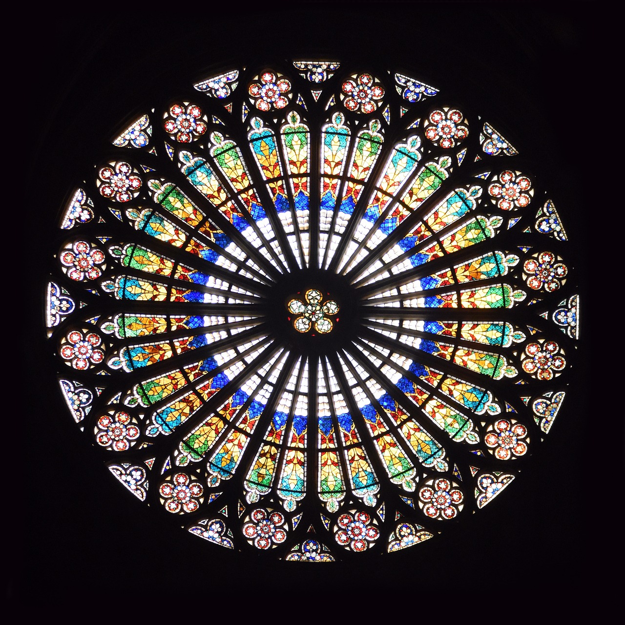 large circular stained glass window at cathedral in europe