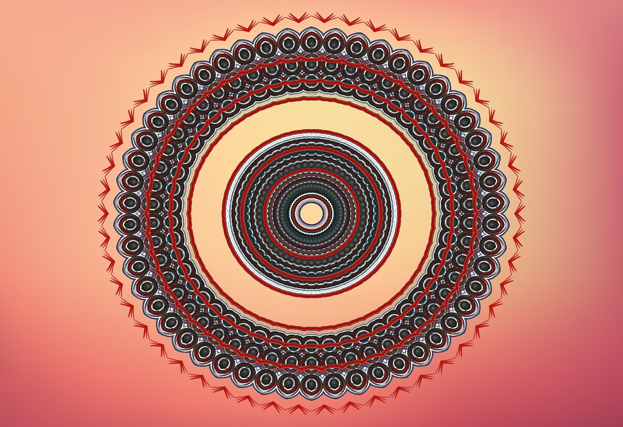 a circular red and black design on an orange background