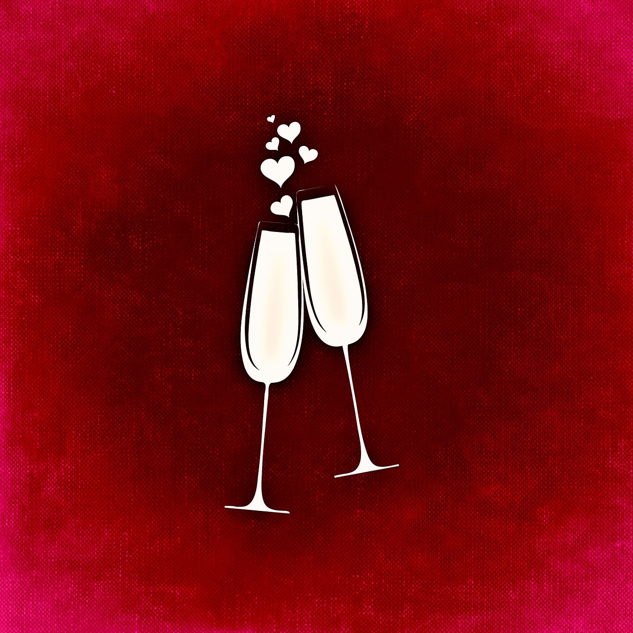 two glasses of wine with hearts on top