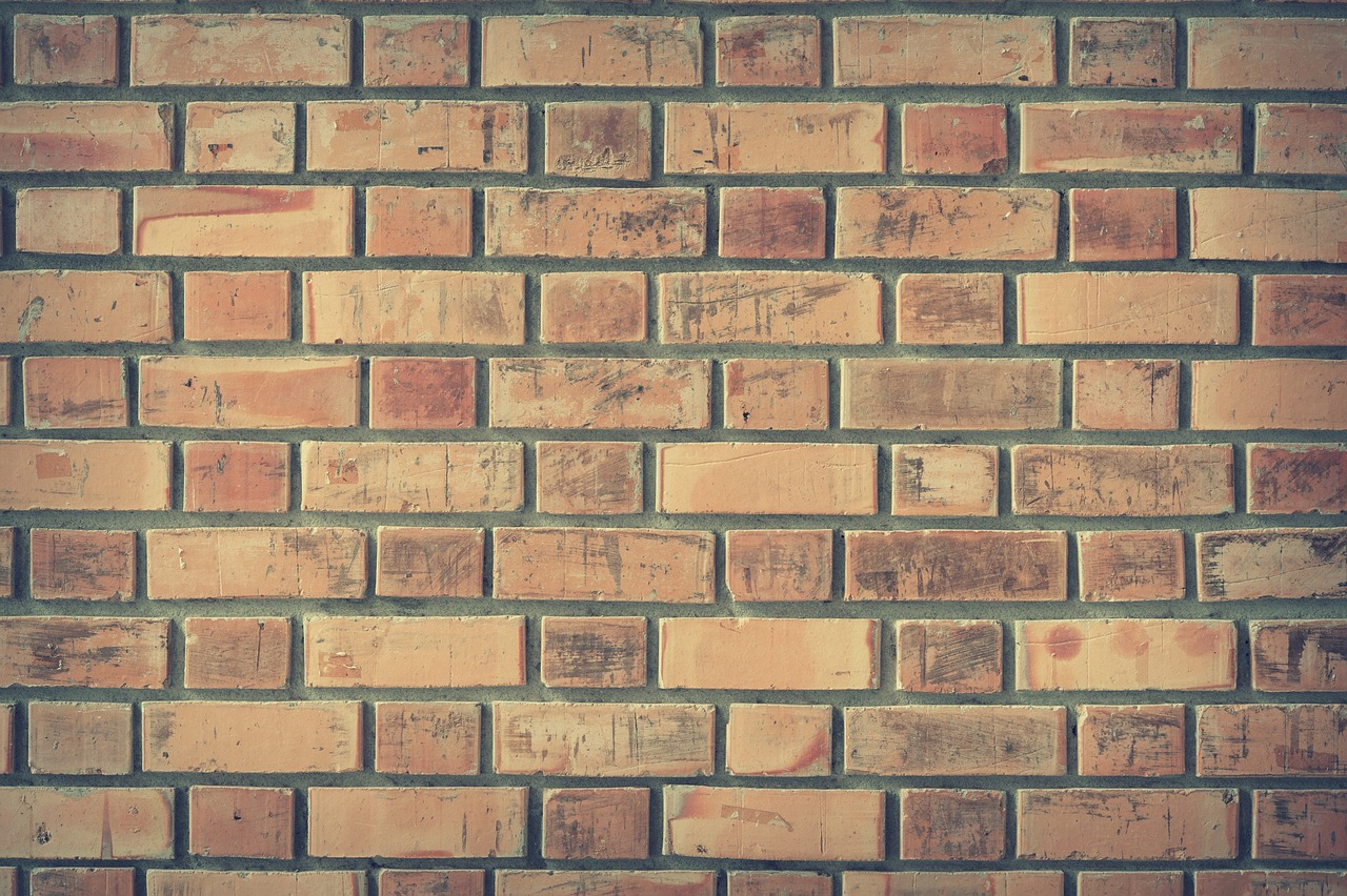 the brick wall is made of different bricks