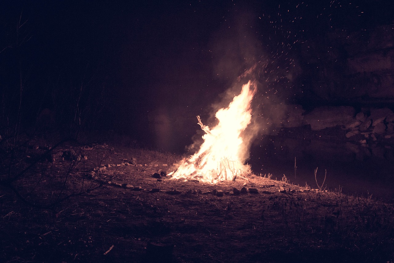 a bonfire in the dark on a dark night