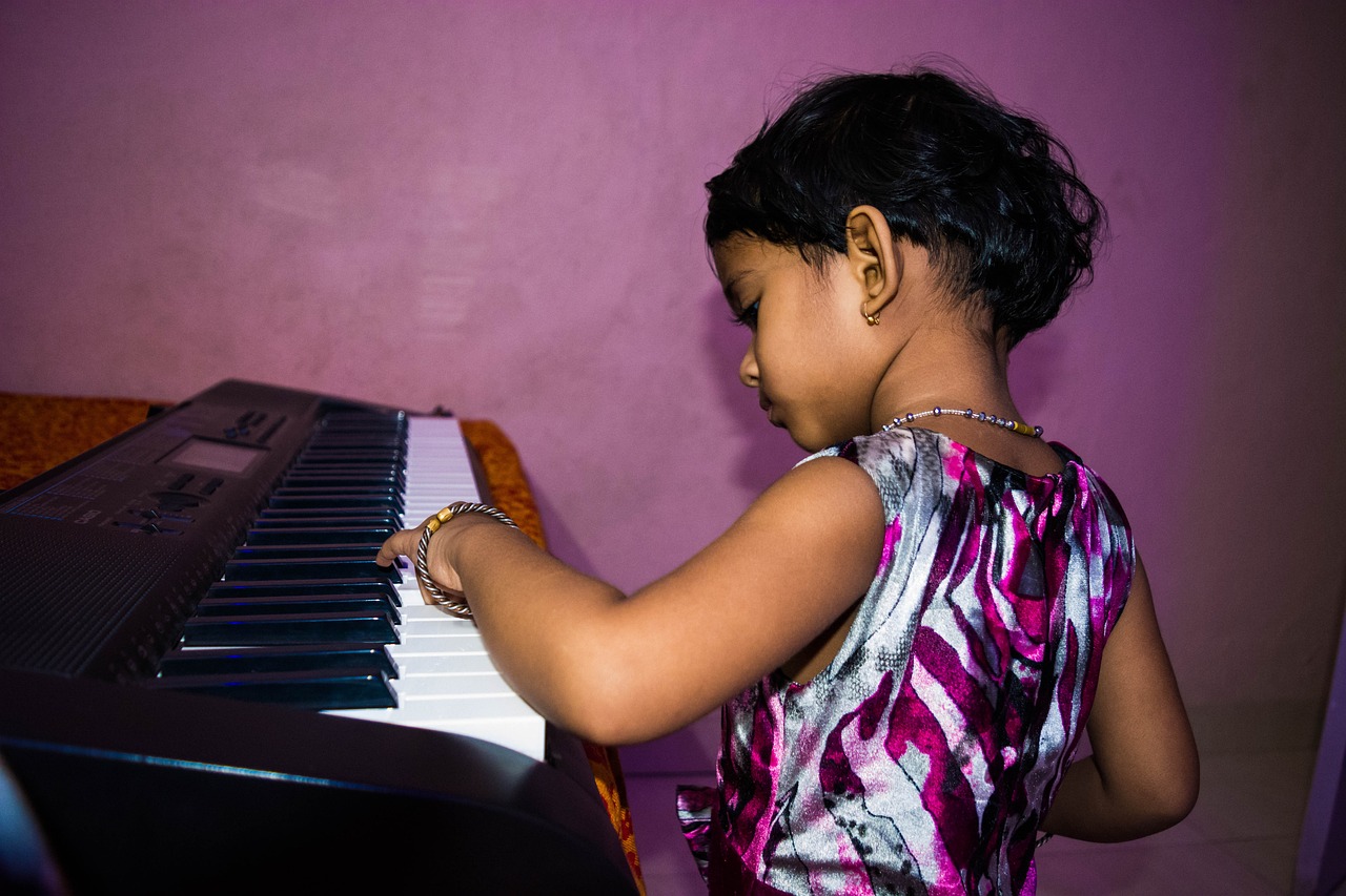 a  playing the piano in a living room