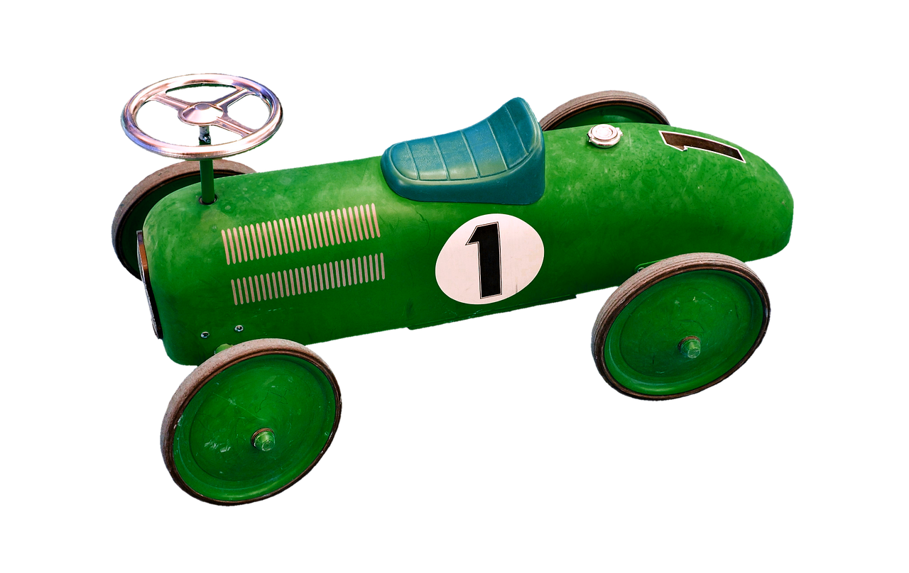 an old fashioned racing car with wheels