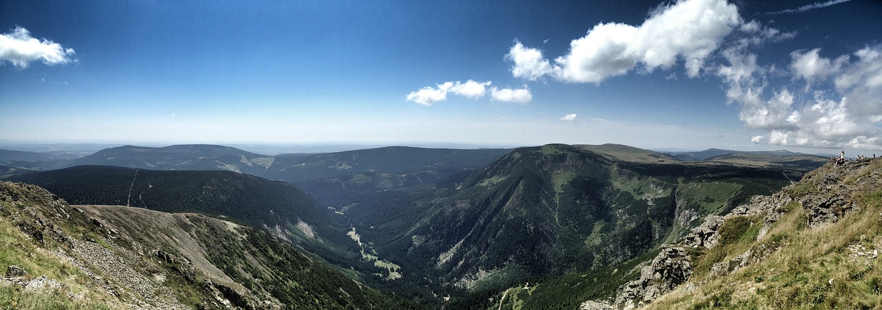 a hill view in the mountain with green mountains