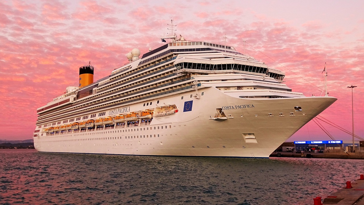 the cruise ship is parked next to a dock