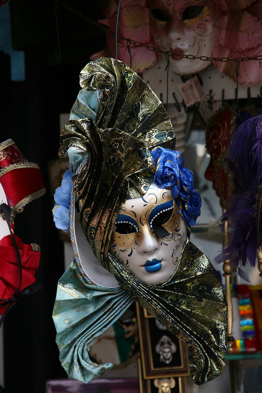 several decorative mardi gras masks hang from the ceiling