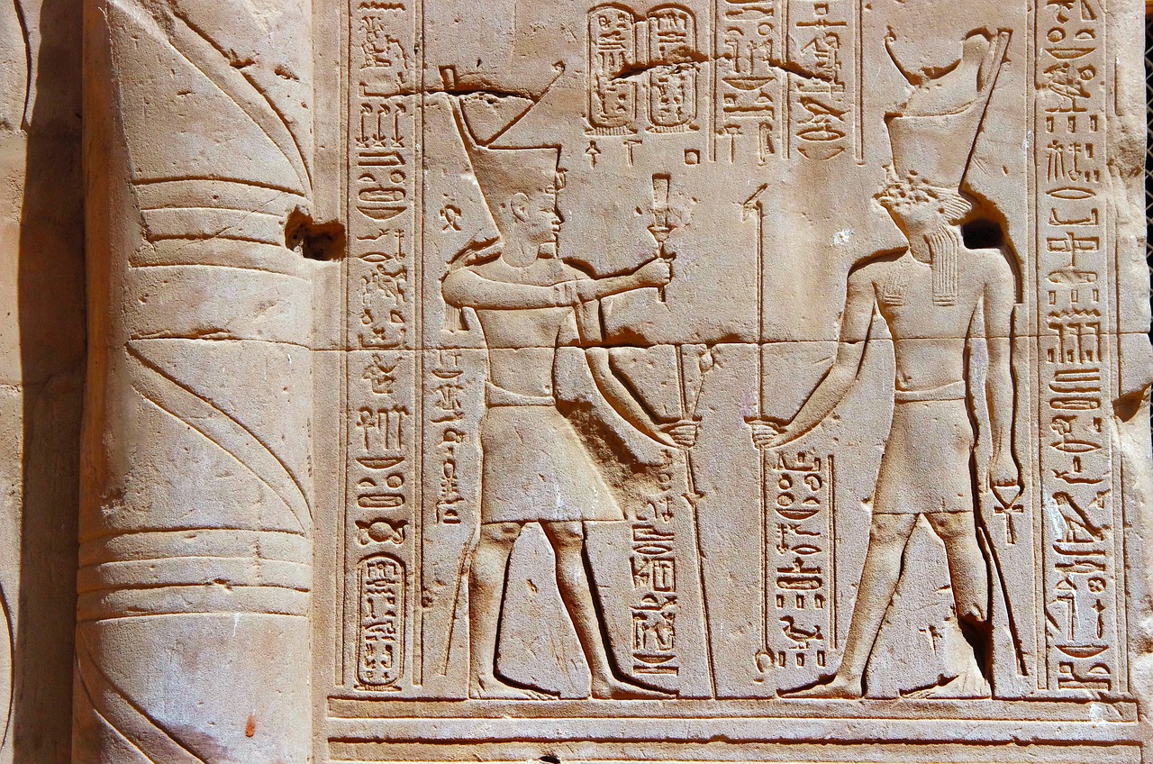 an ancient wall sculpture with a man and a woman