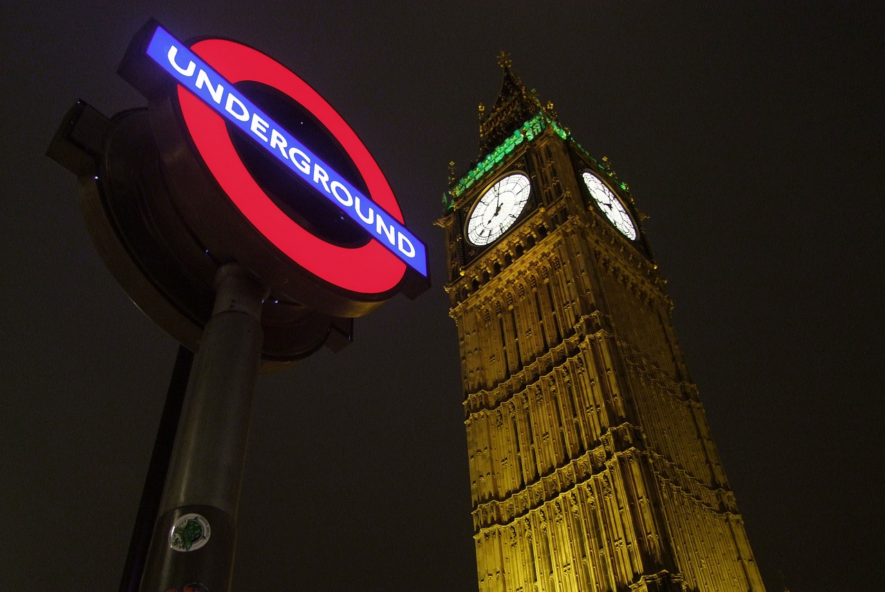 the big ben clock tower is lit up for the city