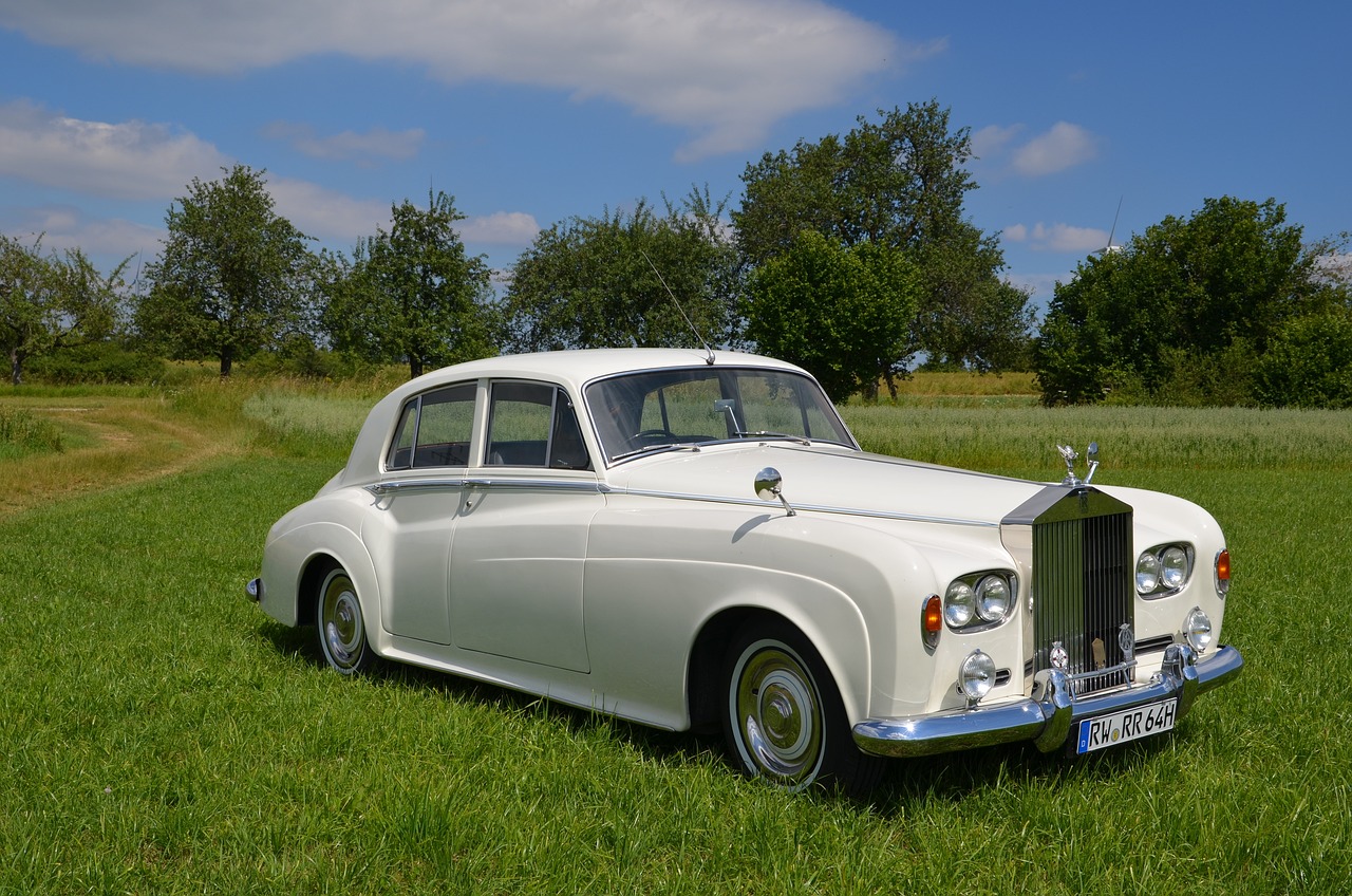 a very cute white car in a field