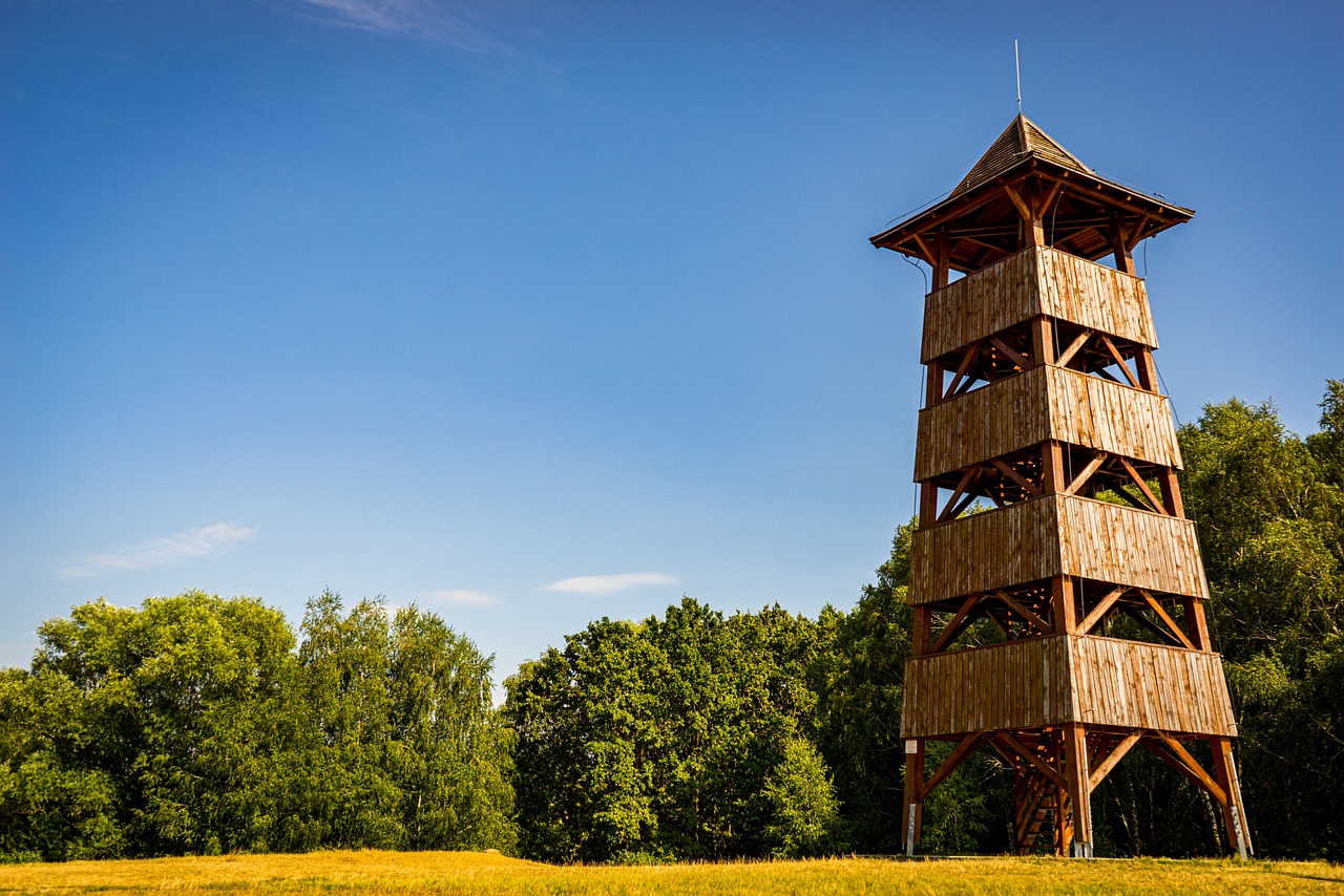 an old wooden tower with a clock on it