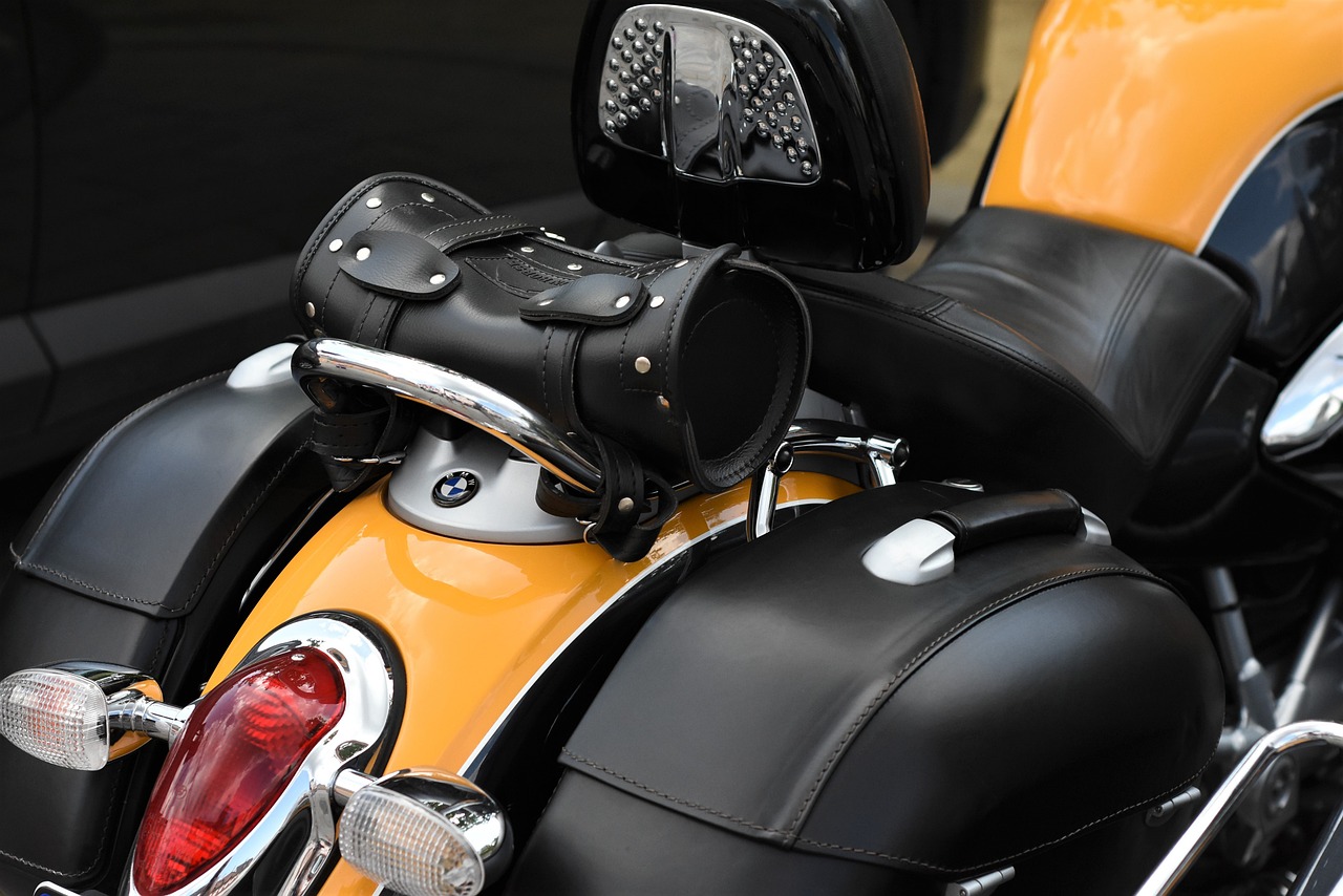 an odd yellow and black motorcycle has its luggage in it