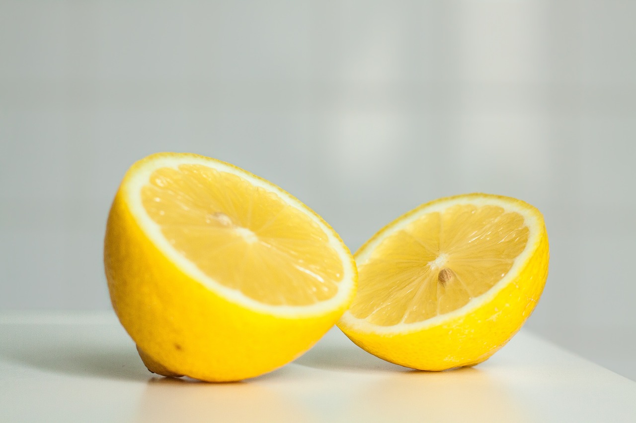 two lemons one slice has yellow center and the other two are white