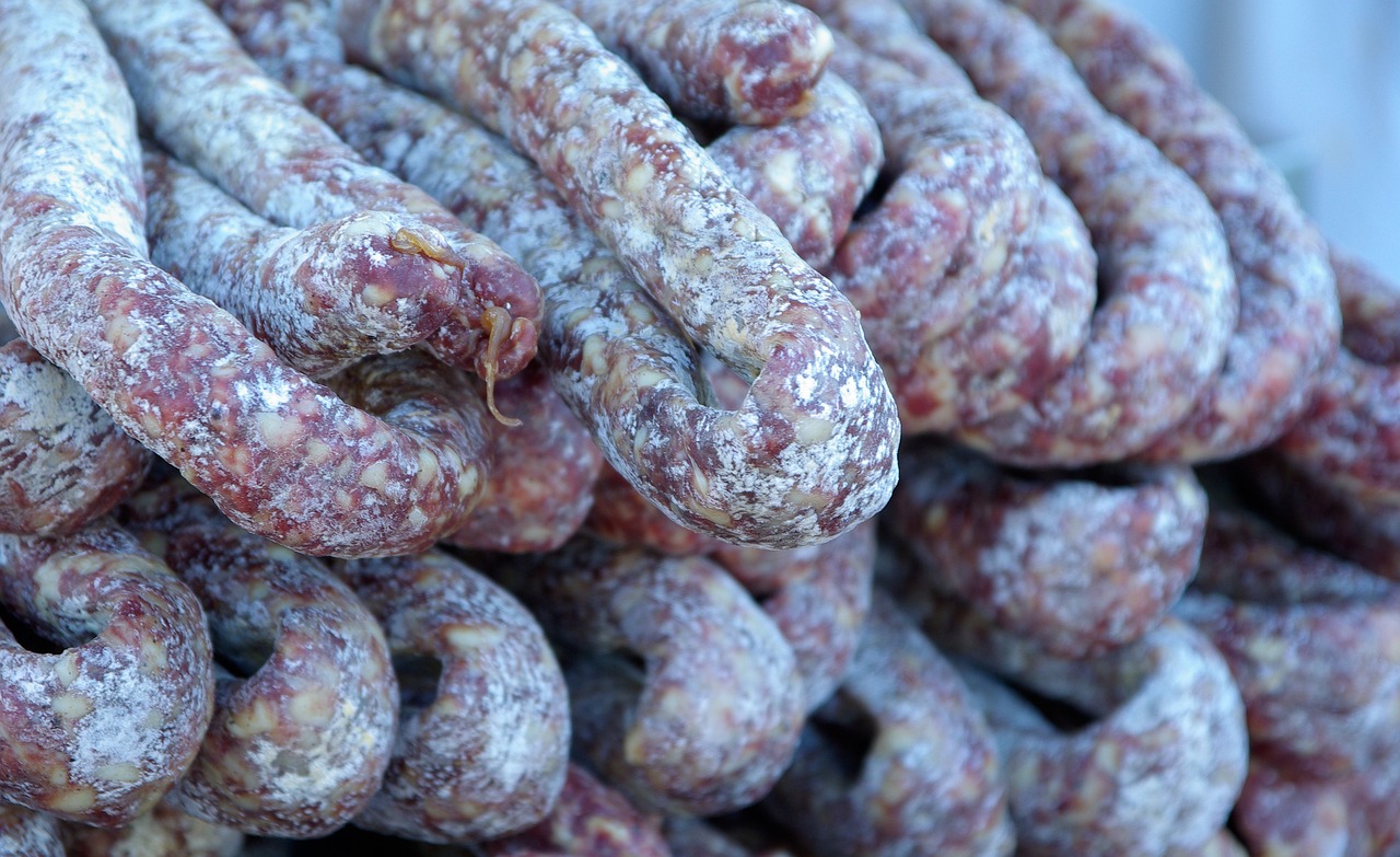 many different types of sausage are stacked on top of each other