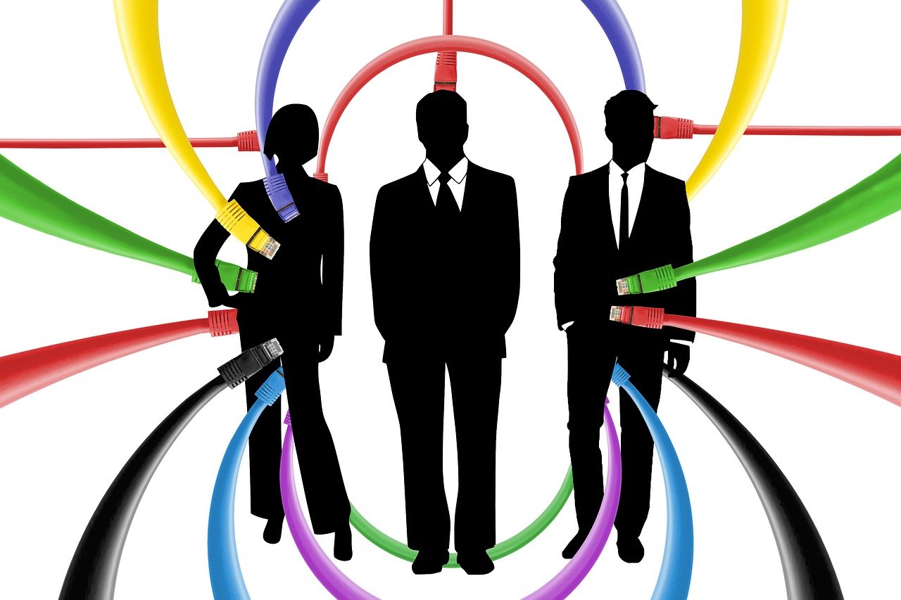 three businessmen in front of a background with colorful circles