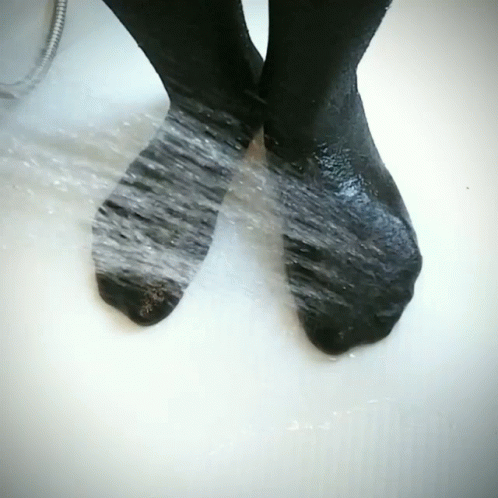 the wet legs of a person with very short hair