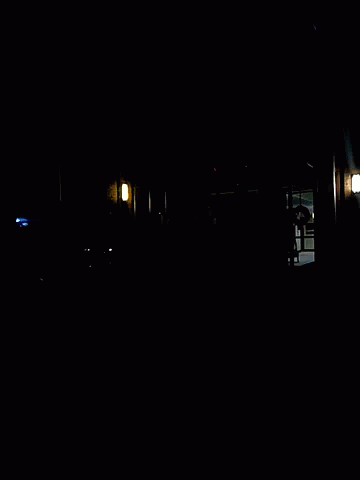 a dark building with the windows open, all lit up