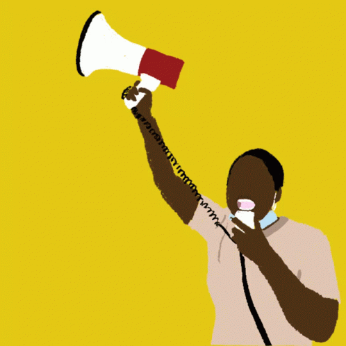 a man holding a megaphone up to his ear