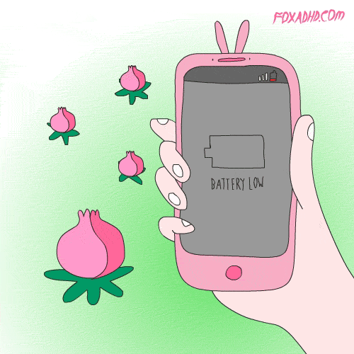 a hand holding an electronic device with flowers flying around it