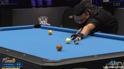 man playing pool with several balls in various positions