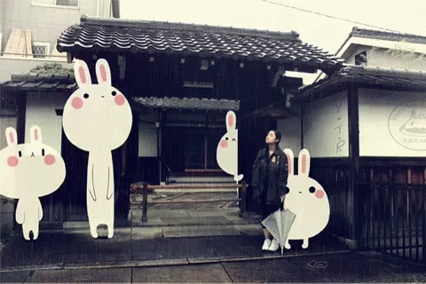 an image of rabbit rabbits in front of a store