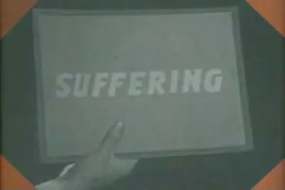the hand is holding the large poster with the word suffering