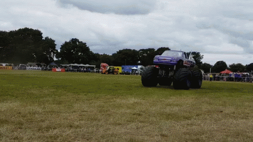 a truck that is standing on some grass