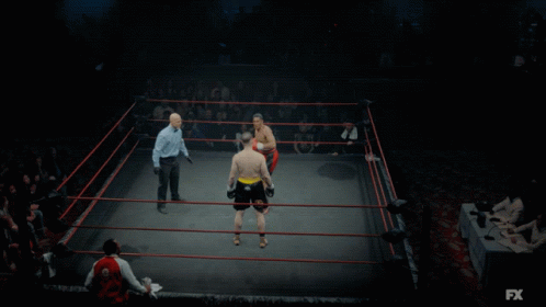 two men are in the ring playing boxing