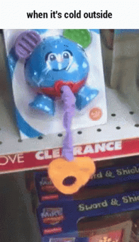 a cartoon bear toy tied to a string in a store