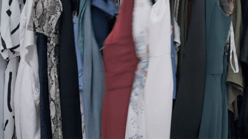 an array of colorful clothes are hung together