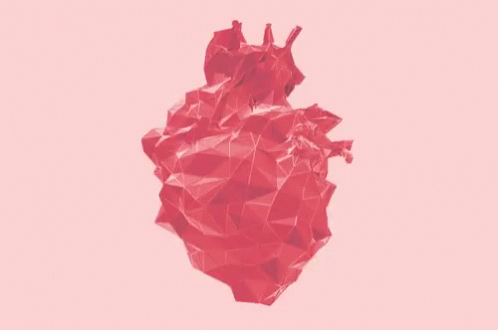 a heart made out of paper on a clear day