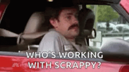 a man driving down a street with the caption who's working with scrappy