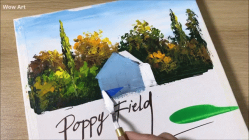 a hand is holding up paint next to some papers with the words poppy field on them