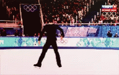 a man skating on an ice rink at a games event