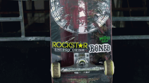 a skate board with graffiti and the word rockstar on it