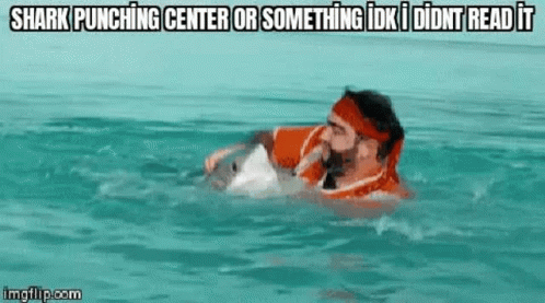 a man in the water with a life vest on