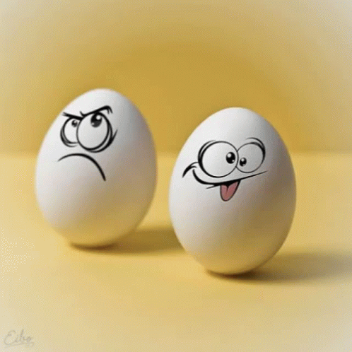 two eggs with faces drawn on them and faces painted on them