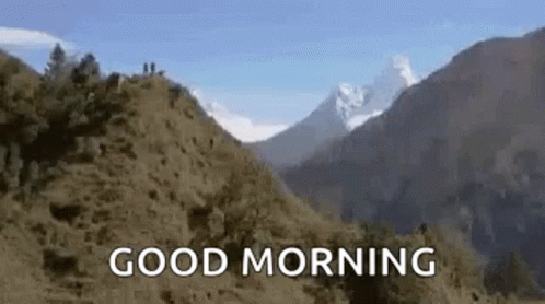 a quote overlays the view of mountains, with the caption saying good morning